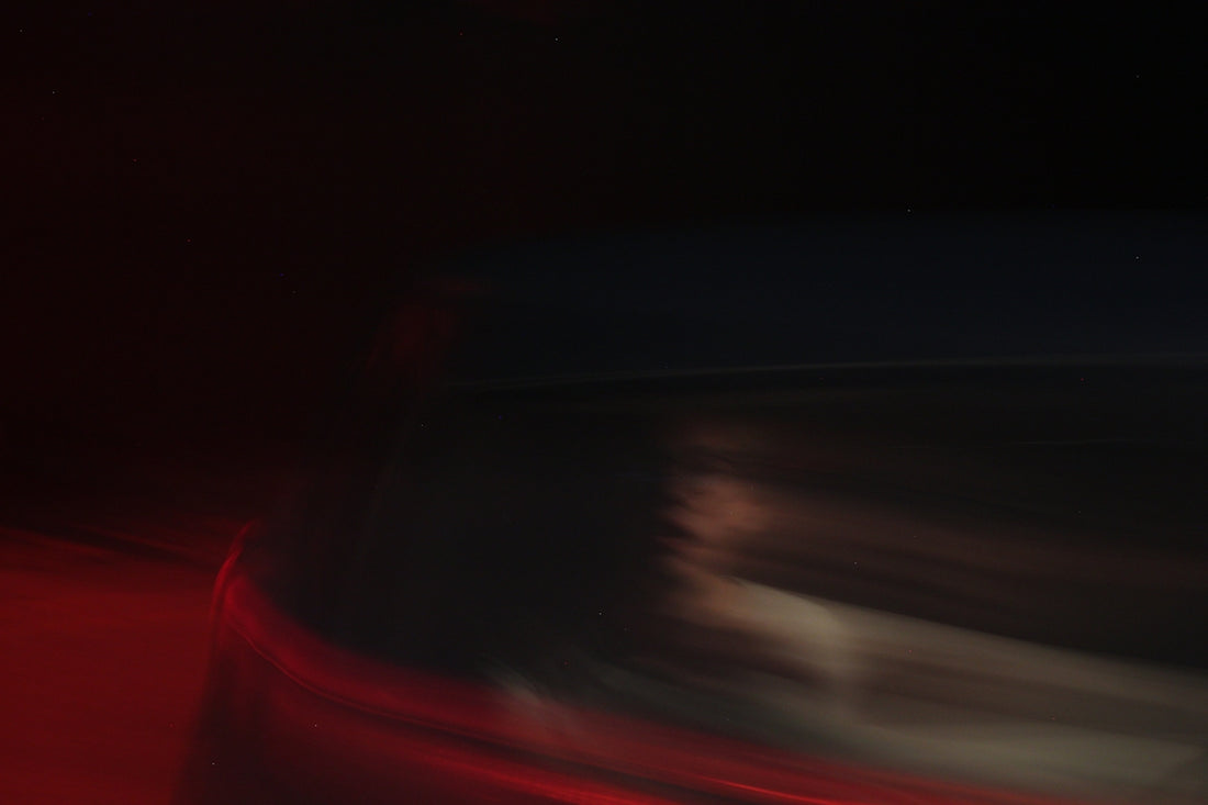 a blurry image of a red and black striped surface