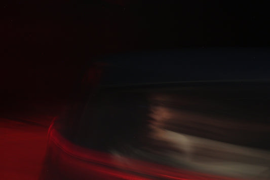 a blurry image of a red and black striped surface
